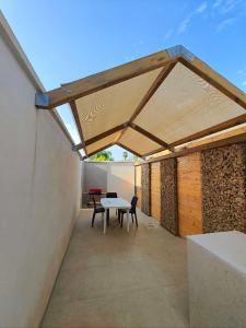 a pavilion with a table on a patio at A casa di Nina in Leverano
