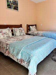 Cama o camas de una habitación en Pousada Cascata de Pedra
