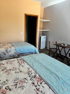 Cama o camas de una habitación en Pousada Cascata de Pedra