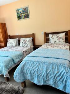 Cama o camas de una habitación en Pousada Cascata de Pedra