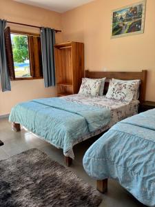 Cama o camas de una habitación en Pousada Cascata de Pedra