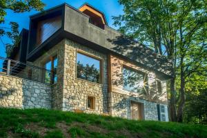 a house built on top of a hill at Villa Maрle Gate in Žabljak