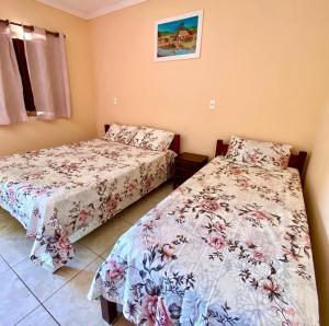 Cama o camas de una habitación en Pousada Cascata de Pedra