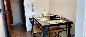 a dining room table with two chairs and a candle on it at Habitación silenciosa Nº1 en Dpto Compartido in Cordoba +8 photos