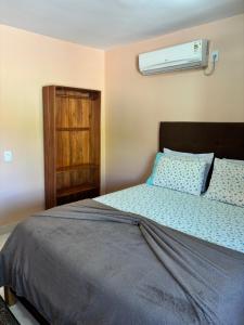 Cama o camas de una habitación en Pousada Cascata de Pedra