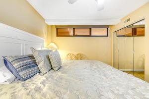 a bedroom with a bed with blue and white sheets at Sea Colony - 509 Dover House Rd. in Bethany Beach +31 photos