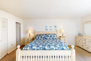 a bedroom with a white bed and two night stands at Sea Colony - 610 Dover House Rd. in Bethany Beach +37 photos