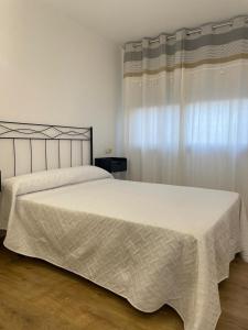 Ένα ή περισσότερα κρεβάτια σε δωμάτιο στο L'apartament de Carol