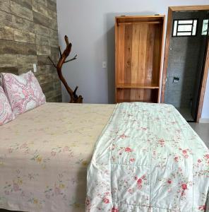 Cama o camas de una habitación en Pousada Cascata de Pedra