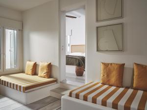 Posteľ alebo postele v izbe v ubytovaní NUMO Mykonos Boutique Resort