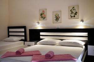 Cama ou camas em um quarto em Marku Palace