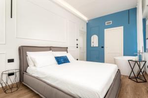 Posteľ alebo postele v izbe v ubytovaní Nelli Rooms Via Veneto