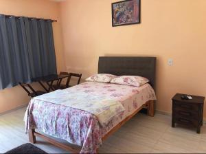 Cama o camas de una habitación en Pousada Cascata de Pedra