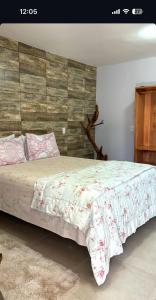 Cama o camas de una habitación en Pousada Cascata de Pedra