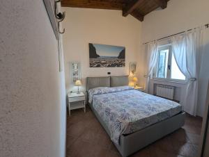 Postel nebo postele na pokoji v ubytování casa vacanze Villa BAIA-LUNA