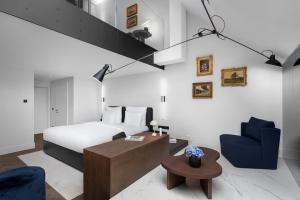 Un pat sau paturi într-o cameră la The Amauris Vienna - Relais & Châteaux