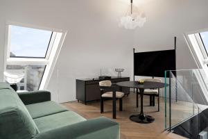 Un televizor și/sau centru de divertisment la The Amauris Vienna - Relais & Châteaux