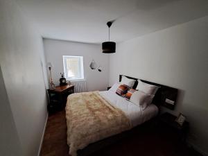 a bedroom with a large bed and a window at Bastide de la Couloubre in Mallemort +31 photos