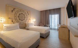 Postel nebo postele na pokoji v ubytování Grand Sirenis Cartagena + 19 fotografií