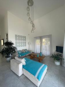 Μια τηλεόραση ή/και κέντρο ψυχαγωγίας στο Superbe penthouse sur la plage
