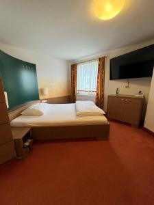 Posteľ alebo postele v izbe v ubytovaní 1A Landhotel Schicklberg