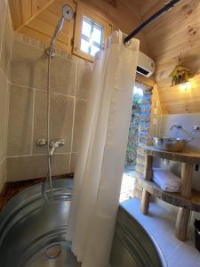 a shower curtain in a bathroom with a sink at Mas Del Flor in Villelongue-dels-Monts +41 photos