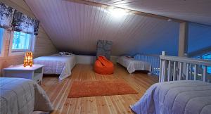 Ένα ή περισσότερα κρεβάτια σε δωμάτιο στο Koskikara Cottage