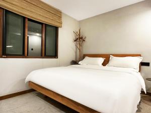 Hangzhou XianQingShan Homestay Westlake客房内的一张或多张床位