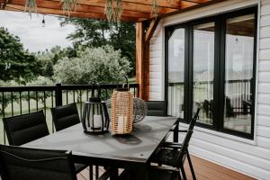 a table on the porch of a house at Oakes House in River Charlo