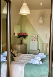 a bedroom with a bed with towels on it at Spacious Studio Apartment with Terrace in Perugia