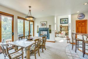 a dining room with a table and chairs at Expansive Edwards Condo on Main Street with Views! in Edwards