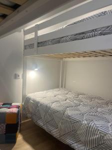 a bedroom with two bunk beds in a room at Friend's House in Maia