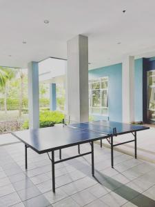 a ping pong table in the middle of a room at jomtien pattaya condo seaview room premium 33sqm in Jomtien Beach