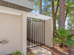 a gate at the entrance to a house at Artist's Tower Townhome Just Renovated w Loft in Gainesville