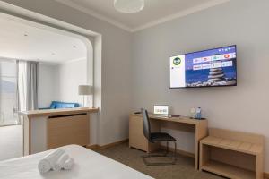 Кровать или кровати в номере B&B Hotels Park Hotel Suisse Santa Margherita Ligure