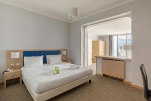 Кровать или кровати в номере B&B Hotels Park Hotel Suisse Santa Margherita Ligure