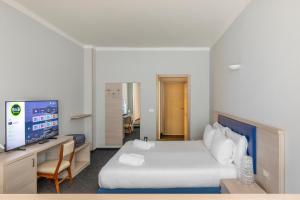 Кровать или кровати в номере B&B Hotels Park Hotel Suisse Santa Margherita Ligure