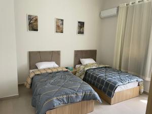 Postel nebo postele na pokoji v ubytování hacienda bay chalet