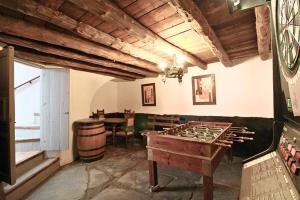 a room with a ping ping pong table in a room with a tablektop at El Pintaillo by SIERRA VIVA in Cortelazor