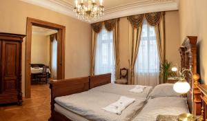 Posteľ alebo postele v izbe v ubytovaní Zlatý Pelikán Apartments