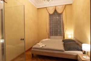 Posteľ alebo postele v izbe v ubytovaní Zlatý Pelikán Apartments