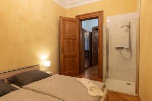 Posteľ alebo postele v izbe v ubytovaní Zlatý Pelikán Apartments