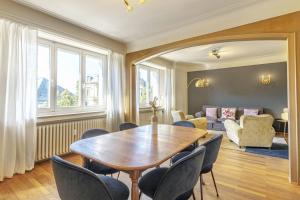 a dining room with a table and chairs at Stylish 2BR Apt with Balcony & Views near Center in Luxembourg