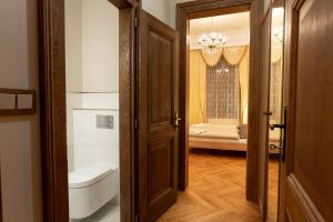 Posteľ alebo postele v izbe v ubytovaní Zlatý Pelikán Apartments