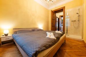 Posteľ alebo postele v izbe v ubytovaní Zlatý Pelikán Apartments