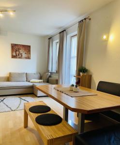 a living room with a table and a couch at Julia, Apart in Finkenberg