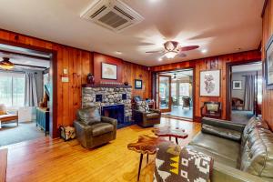 a living room with a couch and a fireplace at Afterglow in Glenn