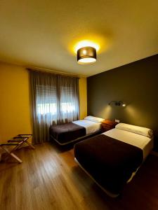 Postel nebo postele na pokoji v ubytování Apartamentos Turisticos Poblado