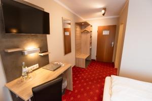 Postel nebo postele na pokoji v ubytování Hotel Pockinger Hof