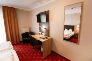 Postel nebo postele na pokoji v ubytování Hotel Pockinger Hof